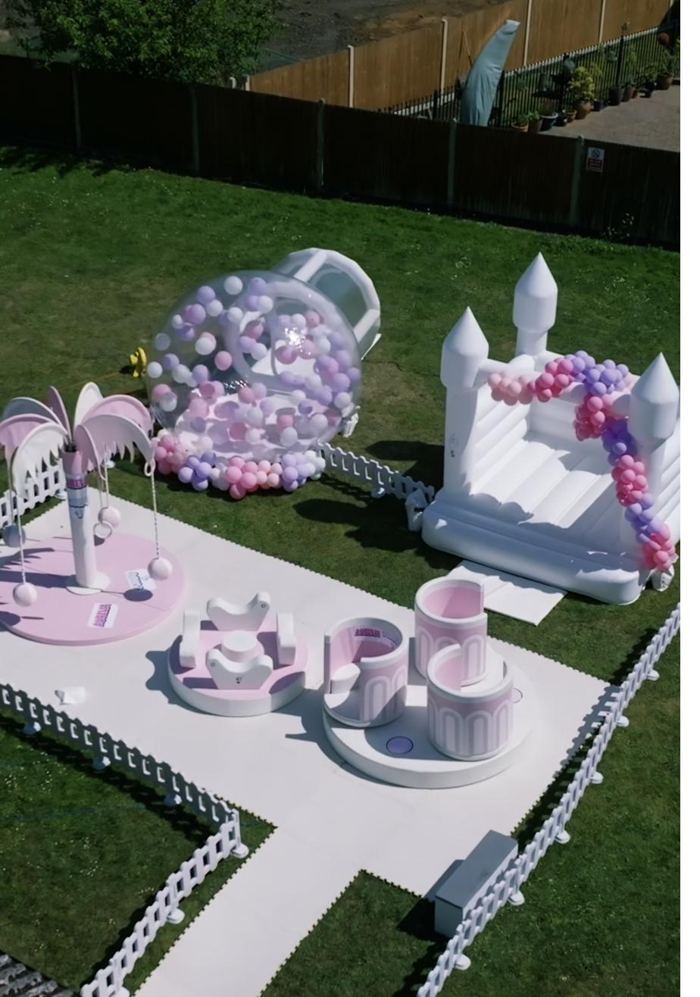 Pink and lilac garden party with Teacup and Animal Carousels, Carousel Tree, Bubble House Dome and bouncy castle